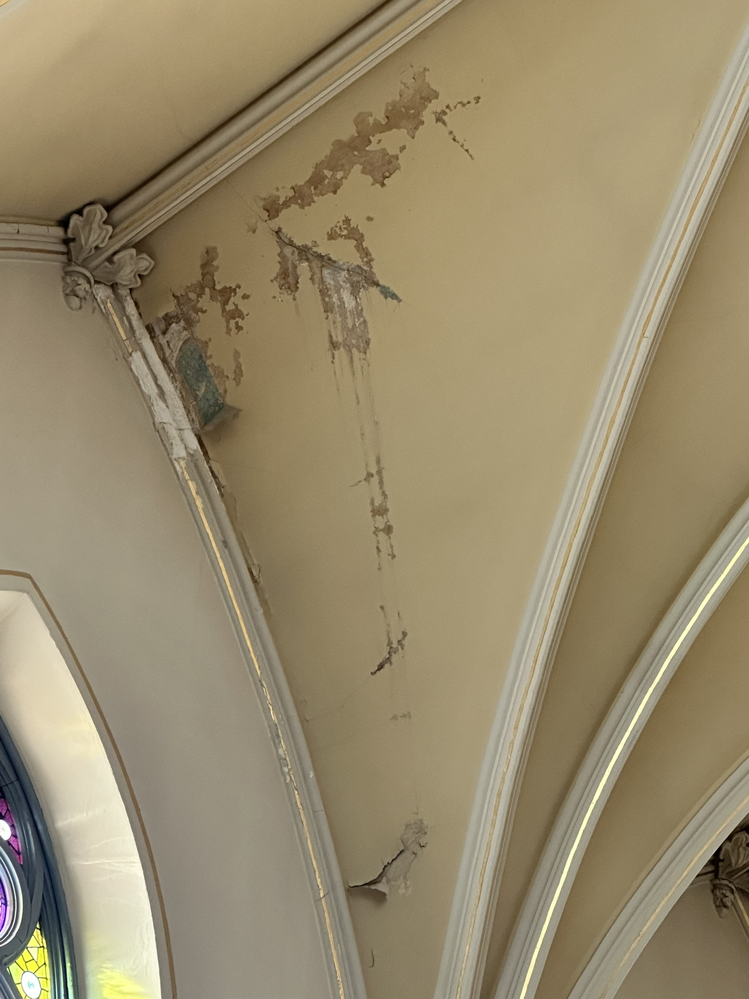 Church ceiling with lead-based paint damaged by water