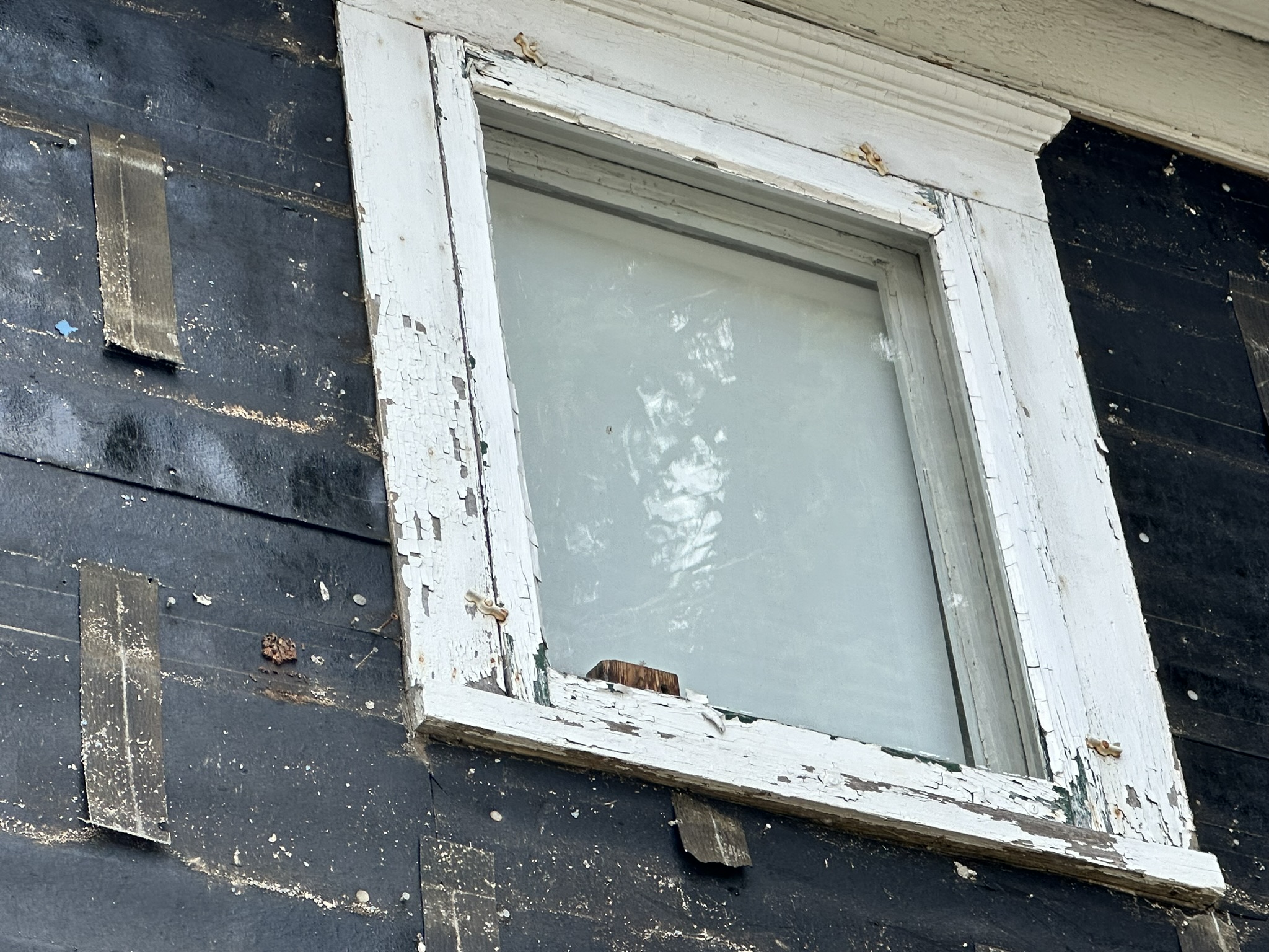 Cracking and chipping lead paint chips on exterior window